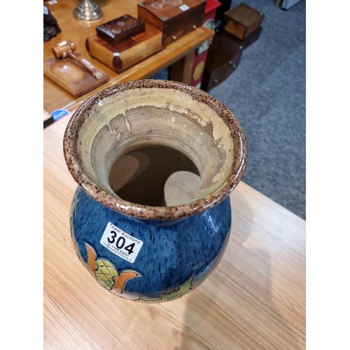 253 - A large antique impressive Belgian glazed vase featuring an incised art nouveau thistle design, made... 