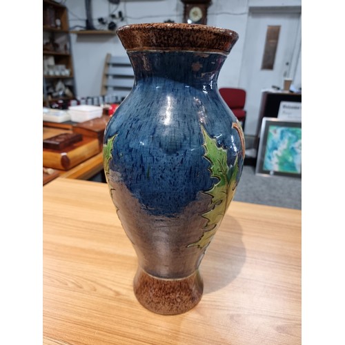 253 - A large antique impressive Belgian glazed vase featuring an incised art nouveau thistle design, made... 