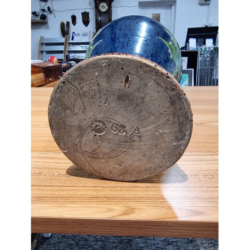 253 - A large antique impressive Belgian glazed vase featuring an incised art nouveau thistle design, made... 