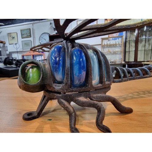 242 - A rare unusual cast iron dragonfly wall hanging tea light holder with hand blown glass, in excellent... 
