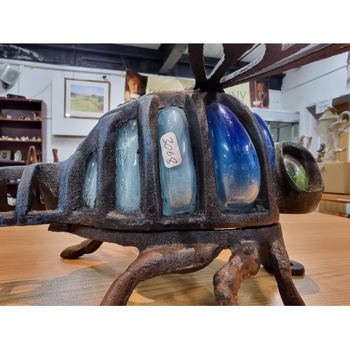 242 - A rare unusual cast iron dragonfly wall hanging tea light holder with hand blown glass, in excellent... 