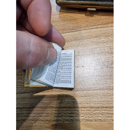 244 - A box containing a quantity of collectables to include a miniature bible and heavy duty brass chain ... 