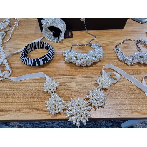 245 - A box full of various costume jewellery to include some new with tags items, all in good order.