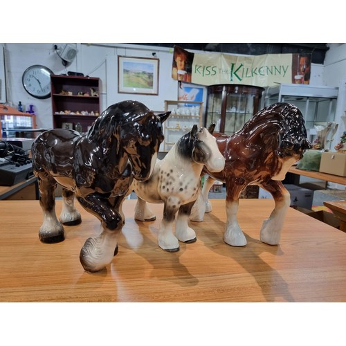 246 - 3 large impressive ceramic cart horses in 3 different colours. 2 have indistinct marks and one has a... 