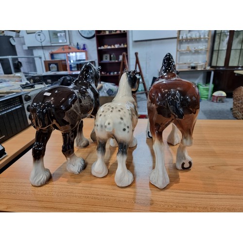 246 - 3 large impressive ceramic cart horses in 3 different colours. 2 have indistinct marks and one has a... 