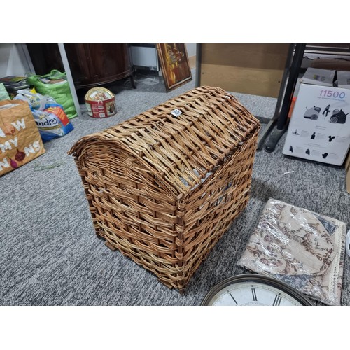 255 - A large wicker linen basket containing a large quantity of fabric tote bags, a large wall clock, a t... 