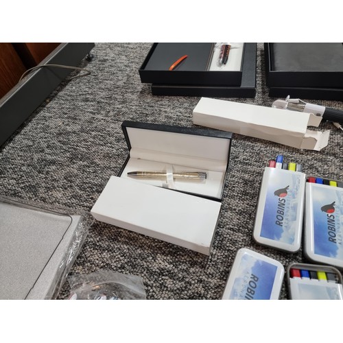 258 - A box of mostly stationary odds to include many pens, 4 boxed as new metal water bottles, pen and no... 