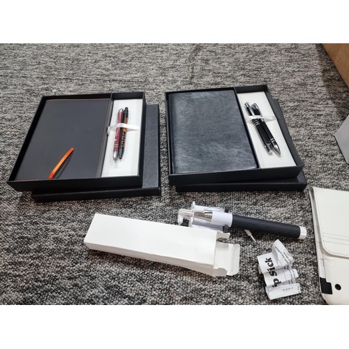 258 - A box of mostly stationary odds to include many pens, 4 boxed as new metal water bottles, pen and no... 