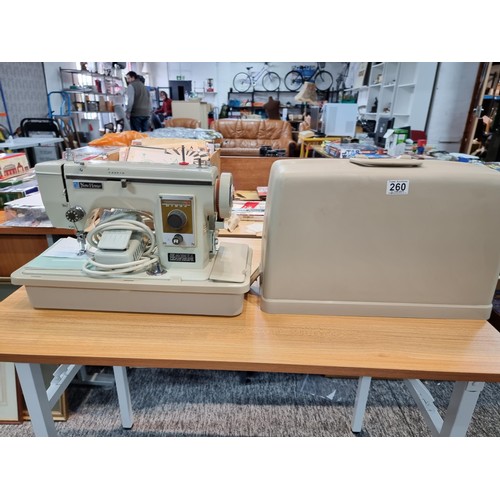 260 - A very clean new home Janome 537 sewing machine in its original case, complete with accessories with... 