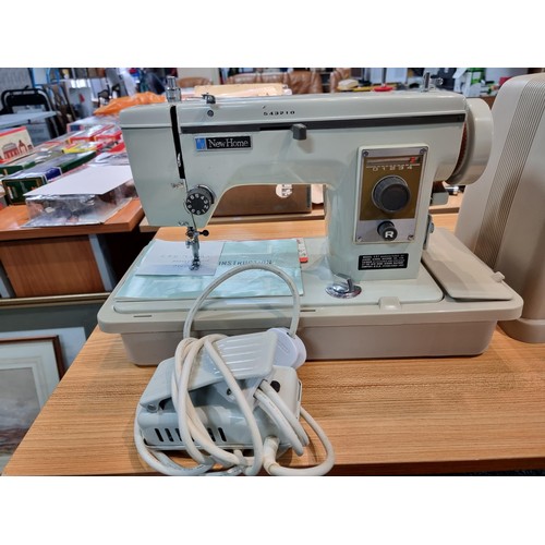 260 - A very clean new home Janome 537 sewing machine in its original case, complete with accessories with... 