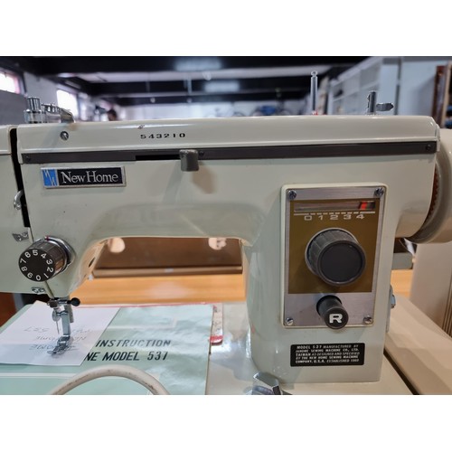 260 - A very clean new home Janome 537 sewing machine in its original case, complete with accessories with... 