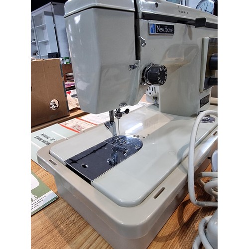 260 - A very clean new home Janome 537 sewing machine in its original case, complete with accessories with... 