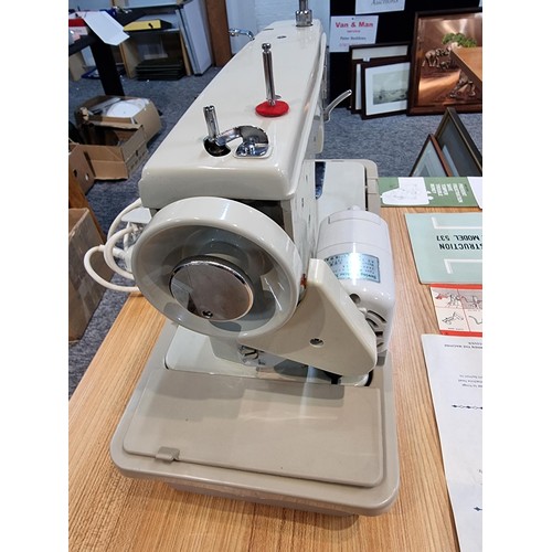 260 - A very clean new home Janome 537 sewing machine in its original case, complete with accessories with... 
