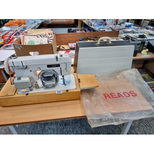 261 - A good quality Read's model 300 sewing machine complete with its foot pedal, original case, and orig... 