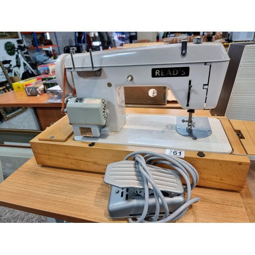 261 - A good quality Read's model 300 sewing machine complete with its foot pedal, original case, and orig... 
