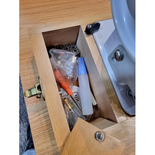 261 - A good quality Read's model 300 sewing machine complete with its foot pedal, original case, and orig... 