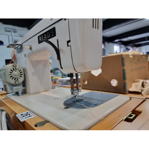 261 - A good quality Read's model 300 sewing machine complete with its foot pedal, original case, and orig... 
