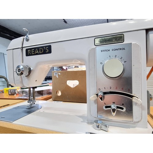 261 - A good quality Read's model 300 sewing machine complete with its foot pedal, original case, and orig... 