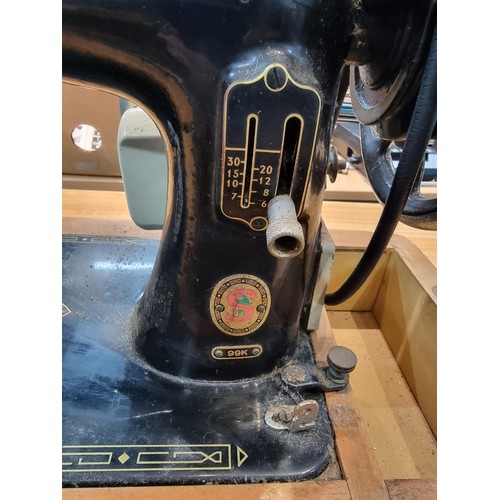 262 - A Singer 99K sewing machine with foot pedal.
