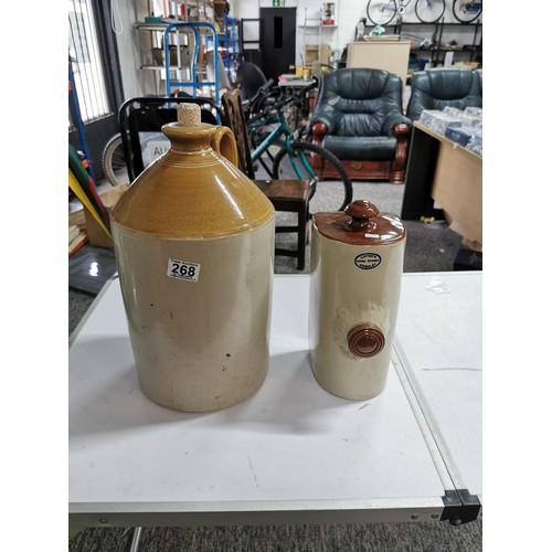 268 - Large stoneware flagon stamped F. Wright & Co, along with a vintage bed warmer with a Listers stamp ... 