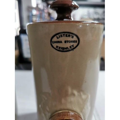 268 - Large stoneware flagon stamped F. Wright & Co, along with a vintage bed warmer with a Listers stamp ... 