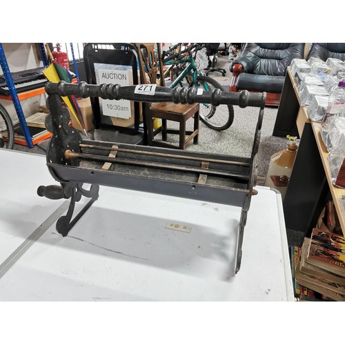 271 - Cast iron dispenser for card paper with ornate edging stands at 36cm high, 55cm long 20cm deep