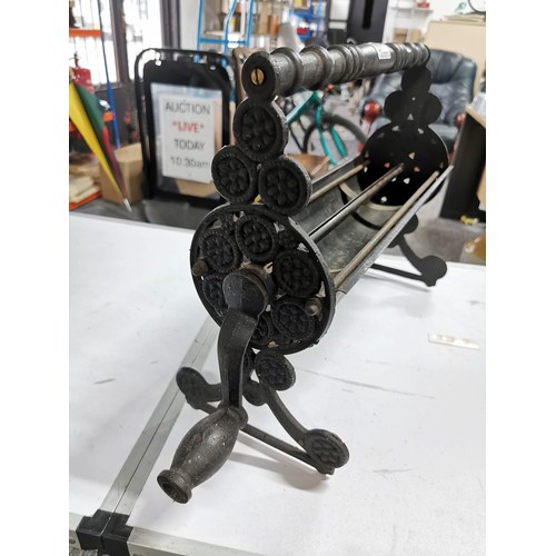271 - Cast iron dispenser for card paper with ornate edging stands at 36cm high, 55cm long 20cm deep