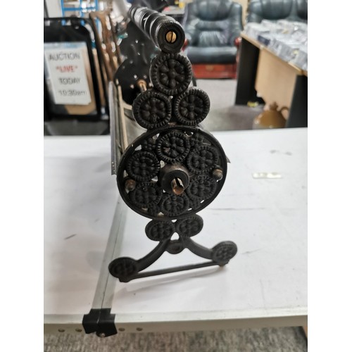 271 - Cast iron dispenser for card paper with ornate edging stands at 36cm high, 55cm long 20cm deep