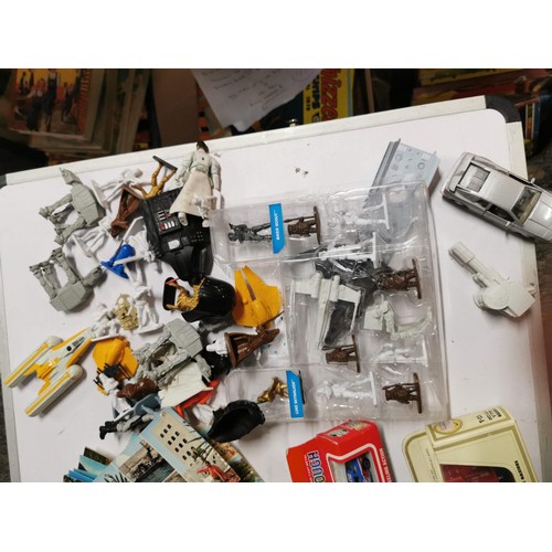 272 - A vintage suitcase full of various toys to inc star wars figures, giant pencil, military figures, ac... 