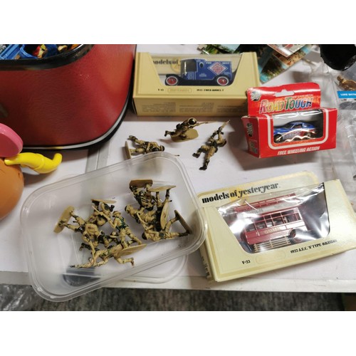 272 - A vintage suitcase full of various toys to inc star wars figures, giant pencil, military figures, ac... 