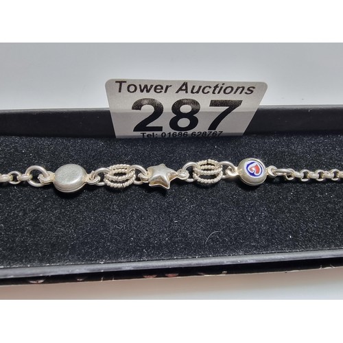287 - A 925 silver bracelet with a start charm and enamel hart charms in good clean condition, boxed. Tota... 