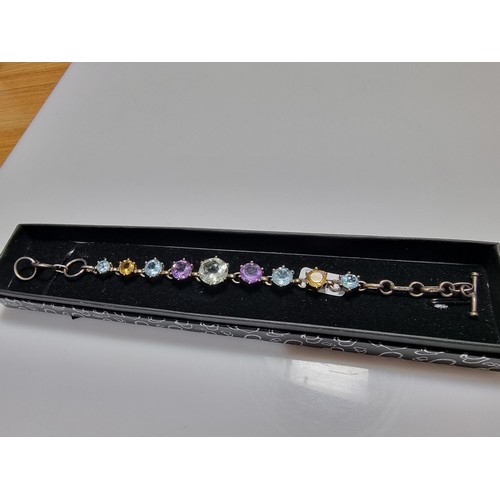 288 - A pretty 925 silver multi gemstone bracelet inset with real quartz, amethyst, topaz, and citrine, in... 