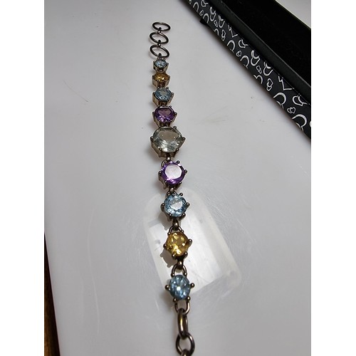 288 - A pretty 925 silver multi gemstone bracelet inset with real quartz, amethyst, topaz, and citrine, in... 