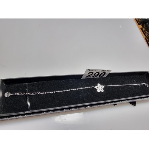 290 - A 925 silver bracelet with a flower charm inset with 15 small diamonds by Katie Loxton, in clean con... 