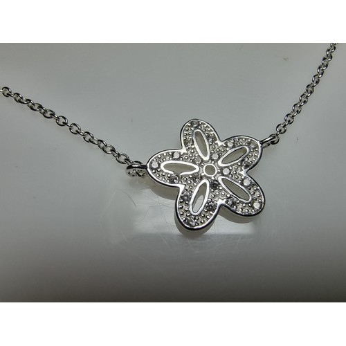 290 - A 925 silver bracelet with a flower charm inset with 15 small diamonds by Katie Loxton, in clean con... 