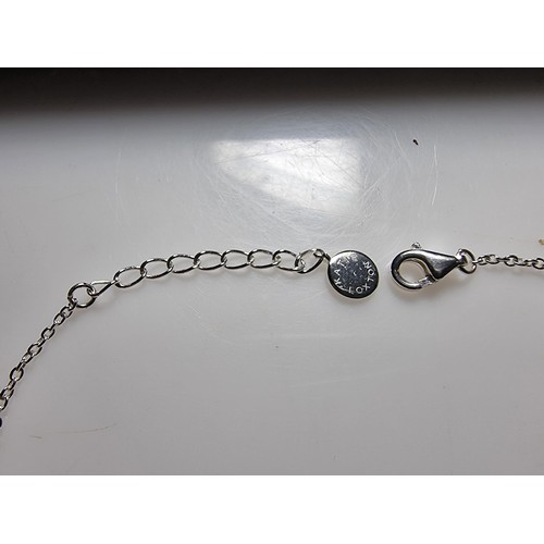 290 - A 925 silver bracelet with a flower charm inset with 15 small diamonds by Katie Loxton, in clean con... 