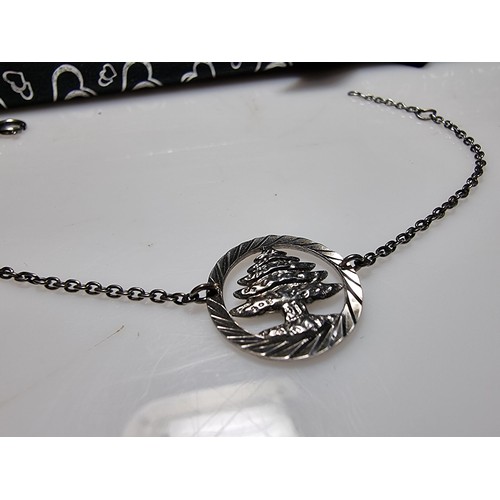 291 - A 925 silver bracelet with a tree charm in good clean condition, boxed. Length of 7