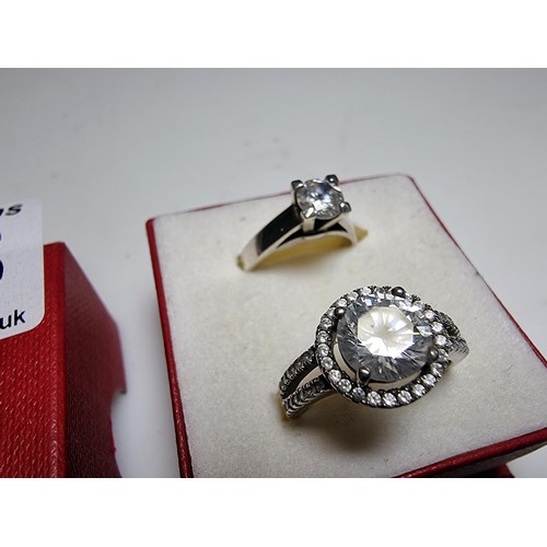 298 - 2x ornate 925 silver dress rings to include a solitaire style ring inset with a sparkly CZ crystal s... 