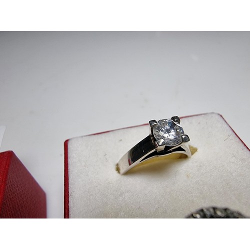 298 - 2x ornate 925 silver dress rings to include a solitaire style ring inset with a sparkly CZ crystal s... 