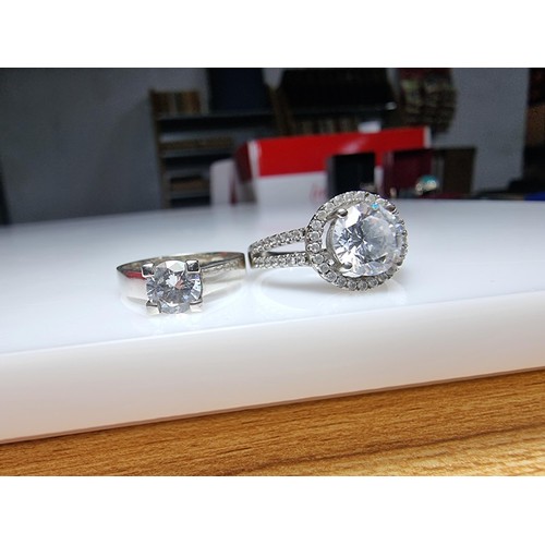 298 - 2x ornate 925 silver dress rings to include a solitaire style ring inset with a sparkly CZ crystal s... 