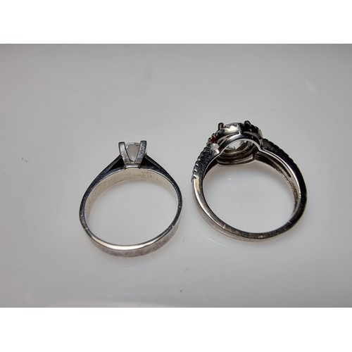 298 - 2x ornate 925 silver dress rings to include a solitaire style ring inset with a sparkly CZ crystal s... 