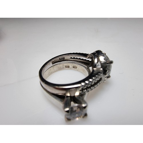 298 - 2x ornate 925 silver dress rings to include a solitaire style ring inset with a sparkly CZ crystal s... 