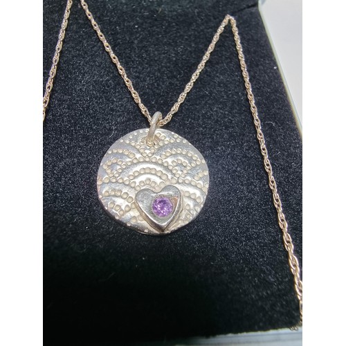 305 - A 925 silver handmade pendant inset with a amethyst set on a long 20