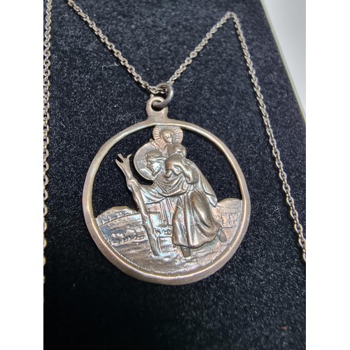 306 - A 925 silver St Christopher pendant on a long 20