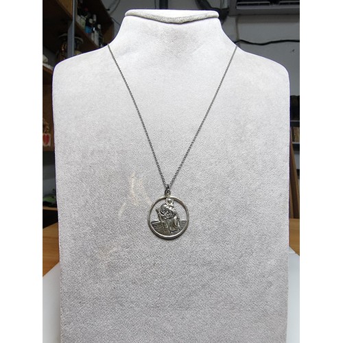 306 - A 925 silver St Christopher pendant on a long 20