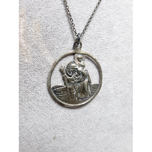 306 - A 925 silver St Christopher pendant on a long 20