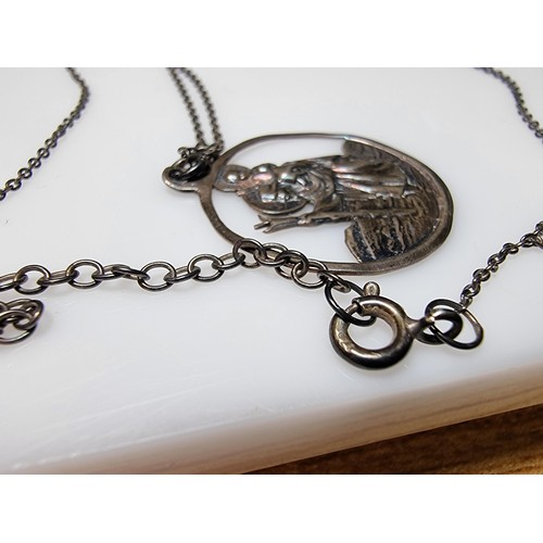 306 - A 925 silver St Christopher pendant on a long 20