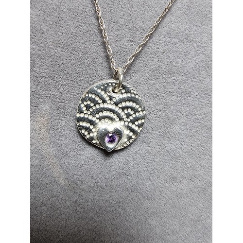 305 - A 925 silver handmade pendant inset with a amethyst set on a long 20