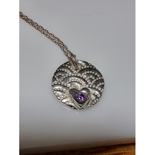 305 - A 925 silver handmade pendant inset with a amethyst set on a long 20