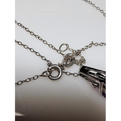 312 - A hallmarked 9ct white gold pendant inset with a large Amethyst gemstones and 2 diamonds set on an 1... 
